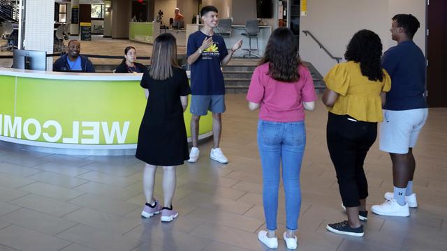 Students at the Welcome Desk as the prepare for a campus tour